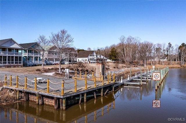 dock area with a water view