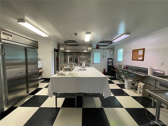 kitchen featuring tile patterned floors and high quality fridge