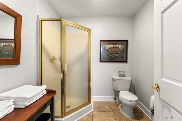 full bathroom with tile patterned flooring, a shower stall, toilet, and baseboards