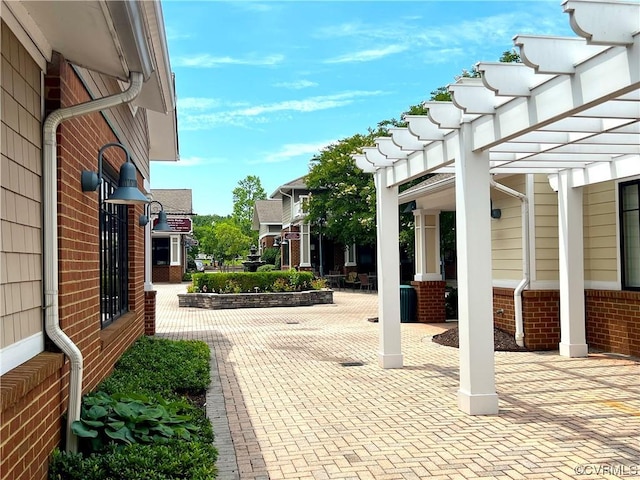 view of patio featuring a pergola