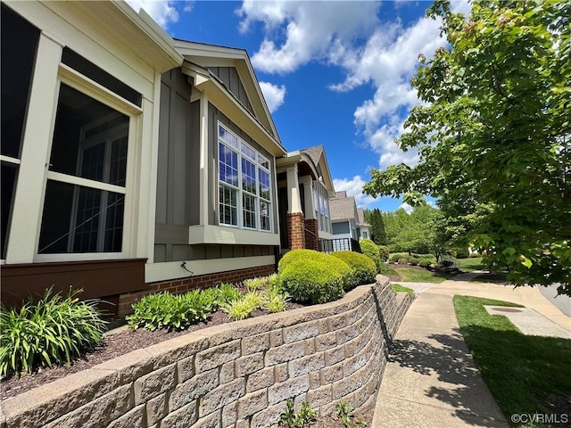 view of side of property with board and batten siding