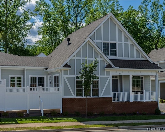 rear view of property with covered porch