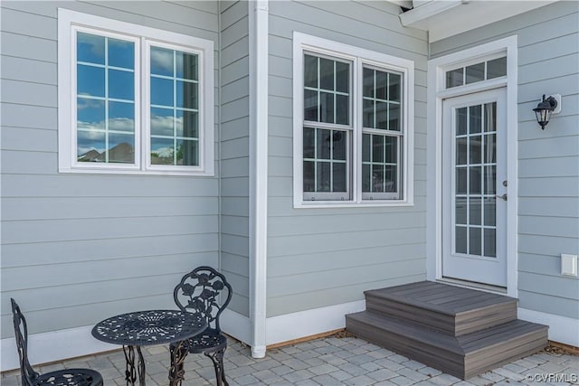 property entrance featuring a patio area