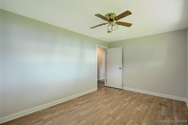 unfurnished room with ceiling fan and light hardwood / wood-style flooring