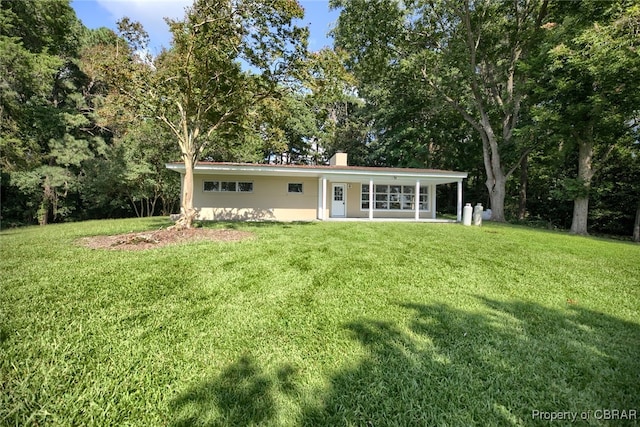 ranch-style home with a front yard