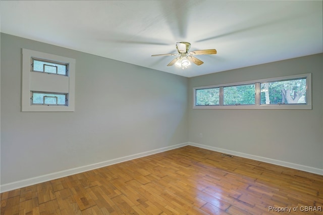 unfurnished room with ceiling fan and light hardwood / wood-style floors