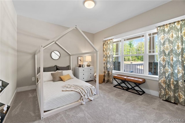 carpeted bedroom featuring baseboards