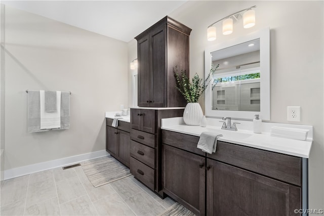 bathroom with tile floors and vanity