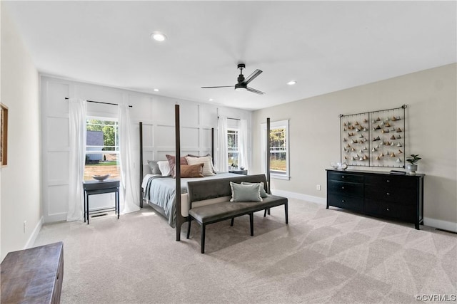 carpeted bedroom with multiple windows, recessed lighting, and baseboards