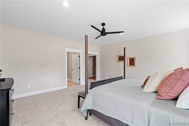 bedroom featuring light carpet, visible vents, a ceiling fan, and baseboards