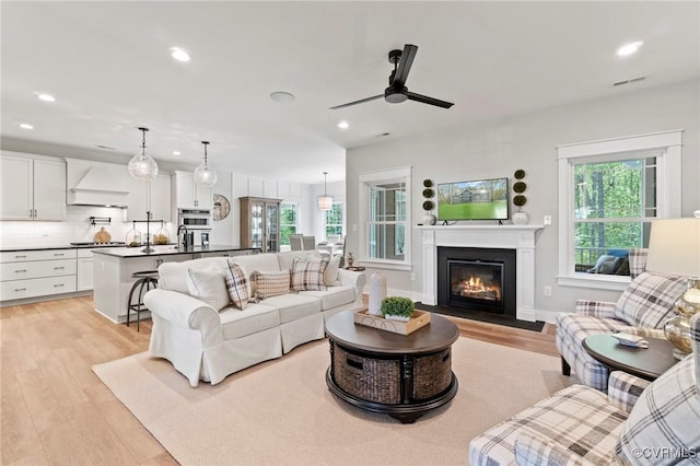 TBD Grass Creek Trail, Little Plymouth, VA 23091 - living room featuring a fireplace with flush hearth, ceiling fan, visible vents, light wood-type flooring, and recessed lighting