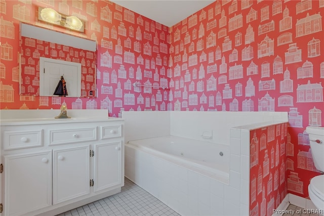 bathroom with tiled bath, tile floors, toilet, and vanity