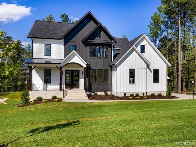 modern inspired farmhouse featuring a front lawn