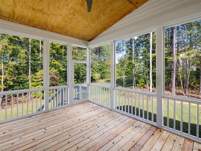 unfurnished sunroom featuring lofted ceiling, wood ceiling, and a wealth of natural light