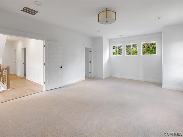 spare room with light colored carpet