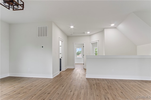 entryway with light wood-type flooring and lofted ceiling