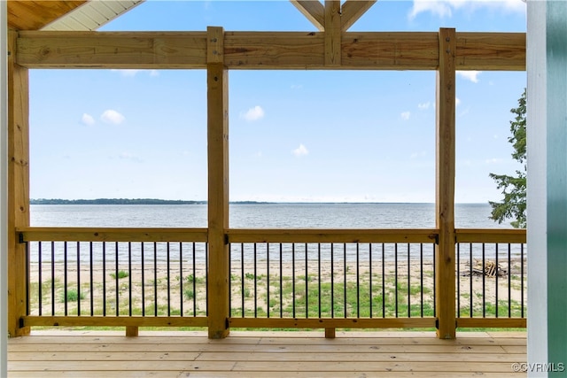 wooden terrace with a water view