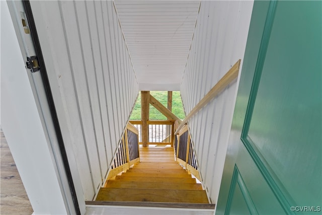 stairs with hardwood / wood-style flooring