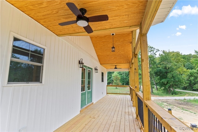 wooden deck featuring ceiling fan