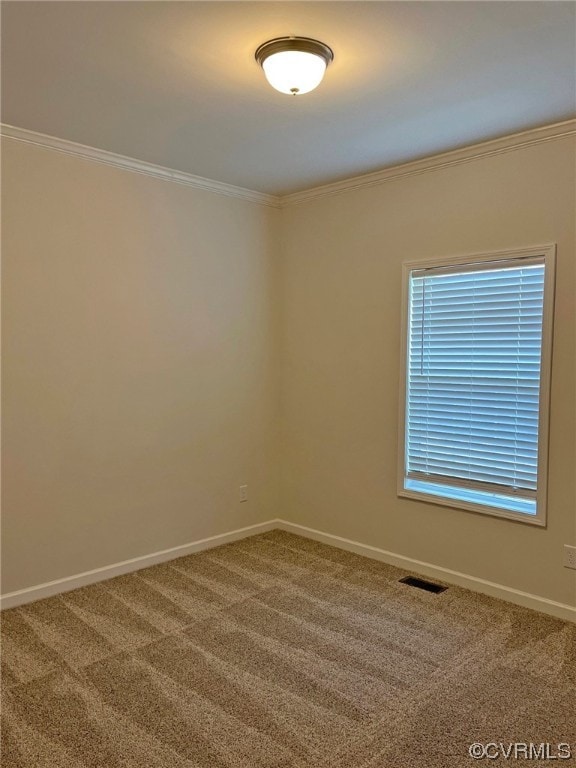 carpeted empty room with crown molding, baseboards, and visible vents