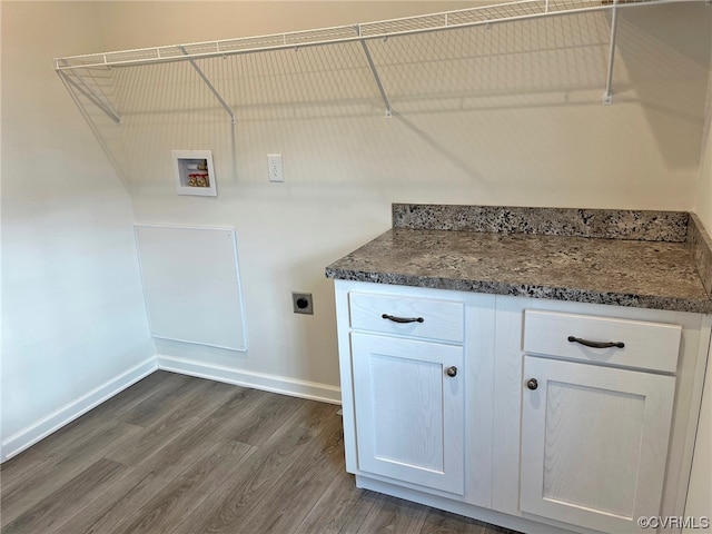 washroom with baseboards, laundry area, dark wood-style flooring, electric dryer hookup, and washer hookup