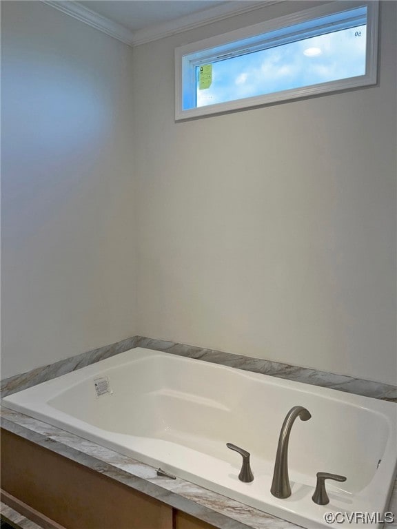 full bathroom with a bath and ornamental molding