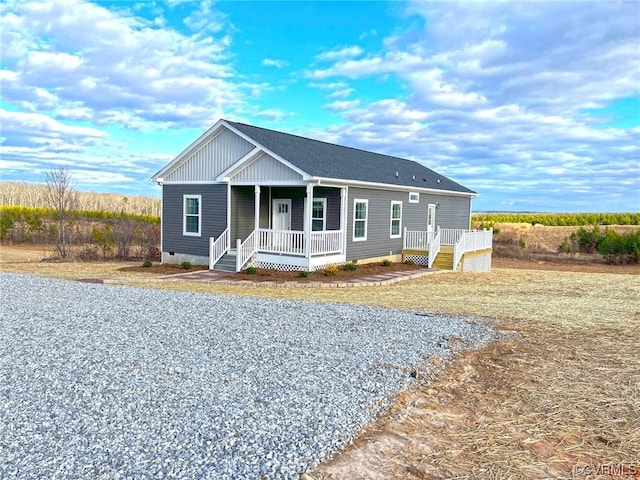 view of front of property with a porch and crawl space