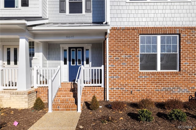 doorway to property featuring a porch