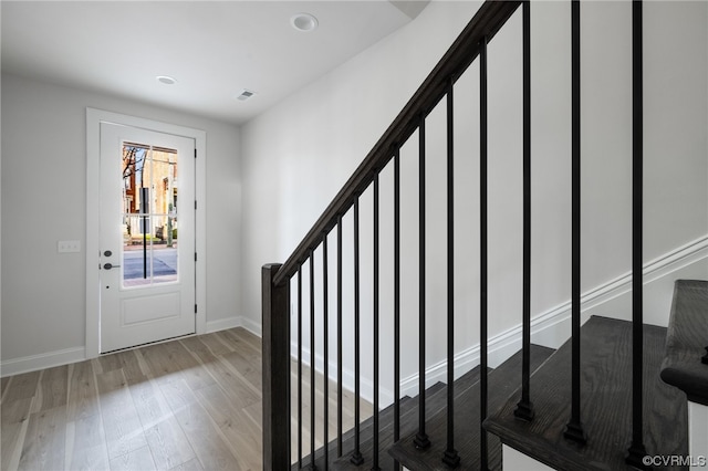 foyer with wood-type flooring