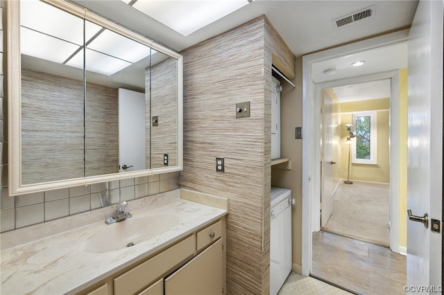 bathroom with tile flooring and vanity