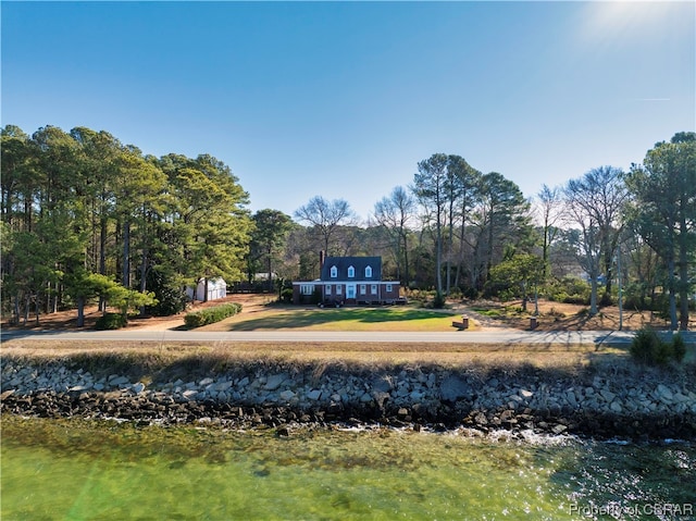 exterior space with a water view