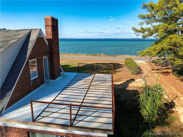 exterior space with a water view