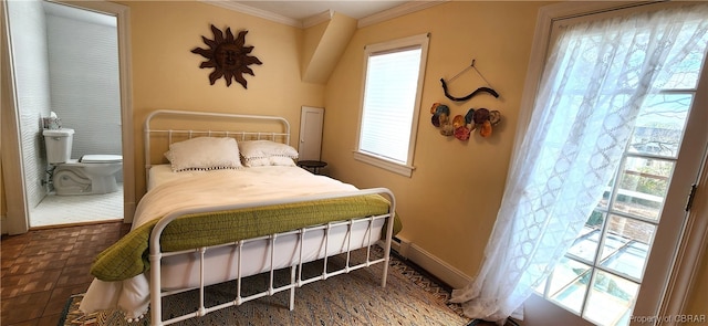 tiled bedroom with ensuite bathroom and ornamental molding