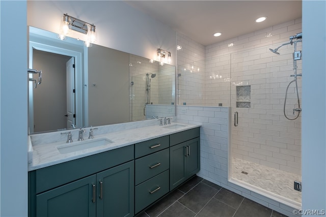 bathroom with tile patterned flooring, an enclosed shower, and dual bowl vanity