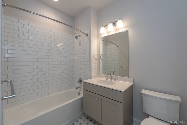 full bathroom featuring vanity, tiled shower / bath, tile patterned flooring, and toilet