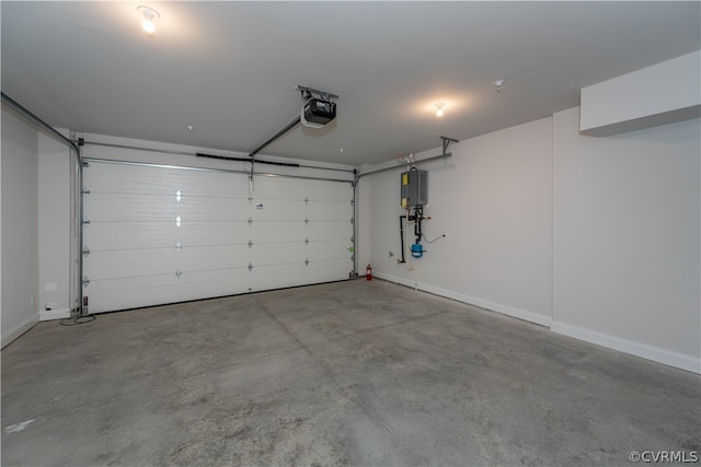 garage with a garage door opener and water heater