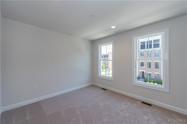 spare room featuring carpet flooring