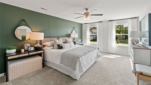 bedroom with ceiling fan and carpet floors