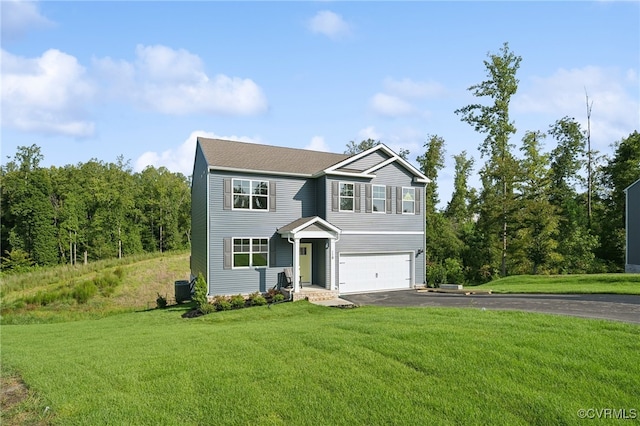 view of front of property featuring a garage and a front yard