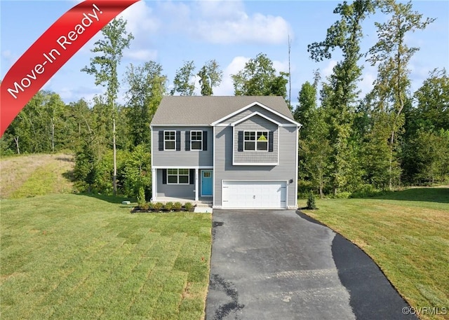 view of front of house featuring driveway, an attached garage, and a front lawn