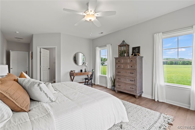 bedroom with dark hardwood / wood-style floors and ceiling fan