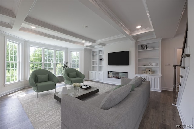 living room featuring hardwood / wood-style floors, built in shelves, crown molding, and beamed ceiling