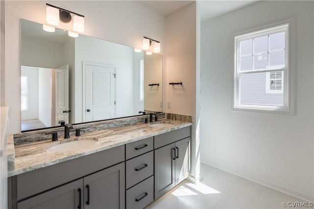 bathroom featuring tile patterned flooring and vanity