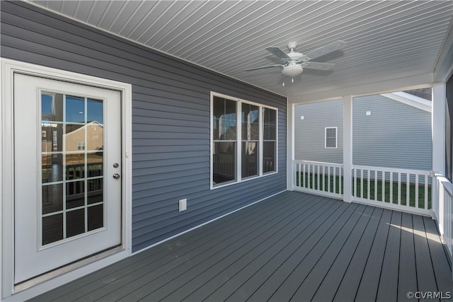 wooden terrace featuring ceiling fan