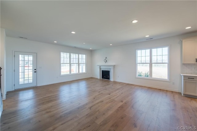 unfurnished living room featuring light hardwood / wood-style flooring