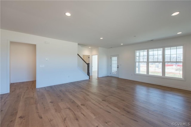 unfurnished living room featuring light wood-type flooring