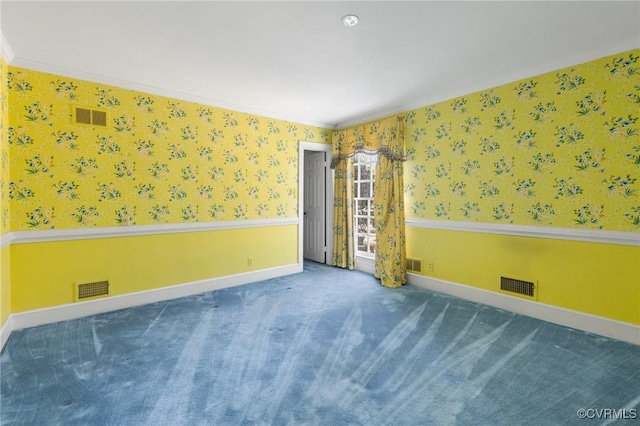 carpeted spare room featuring ornamental molding