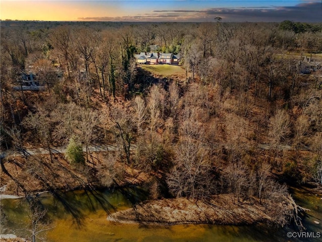 aerial view at dusk with a water view