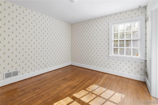 empty room featuring hardwood / wood-style flooring