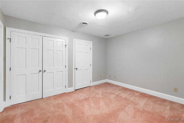 unfurnished bedroom with carpet floors